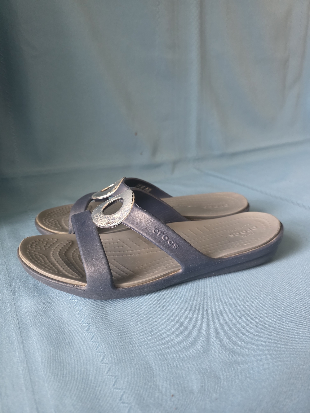 Crocs Navy Slip‑On Sandals with Silver Medallion Accent Women’s 9